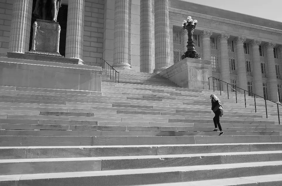 a person jumping up and down a set of stairs